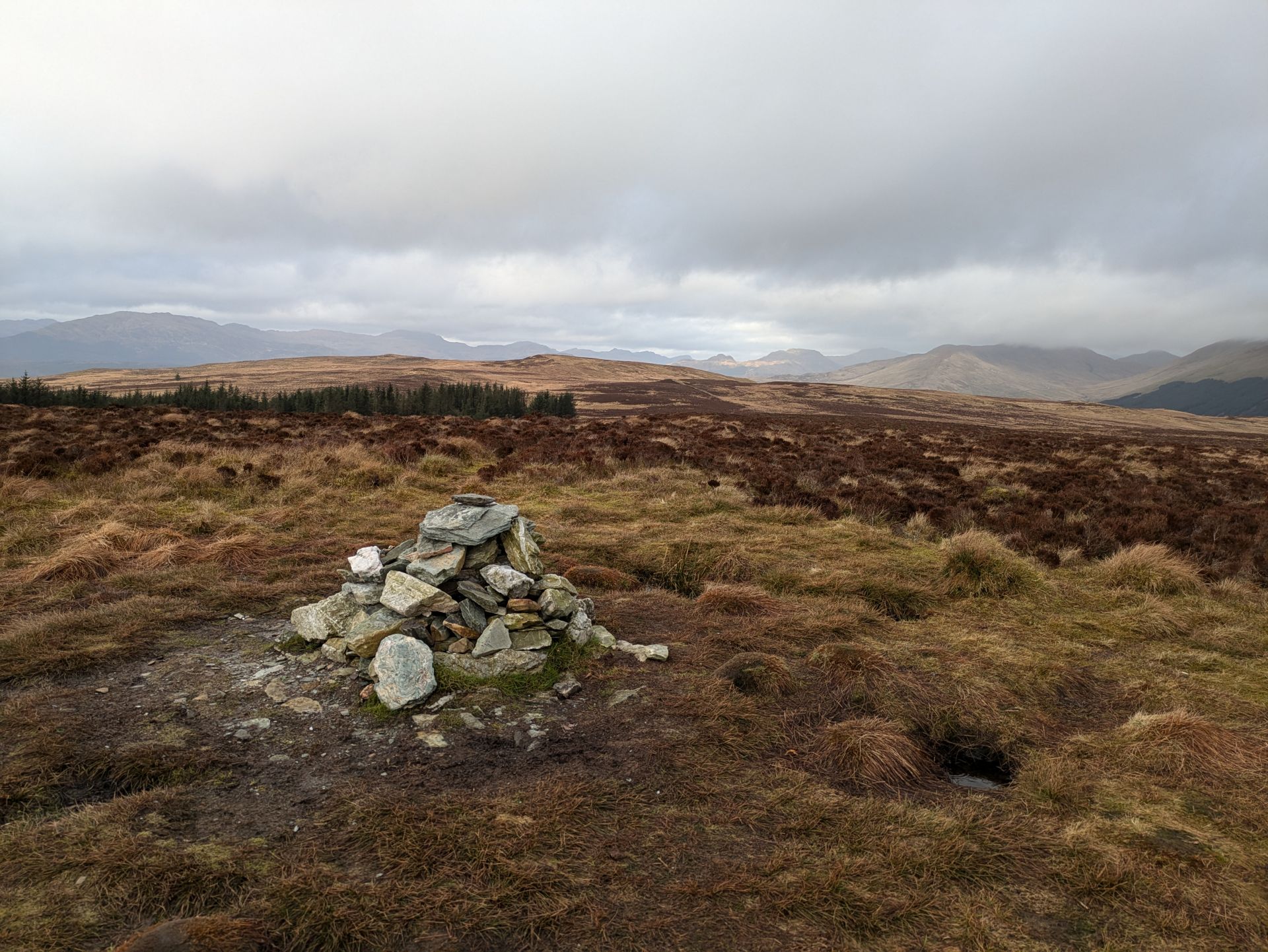 Summit cairn in gloomy weather